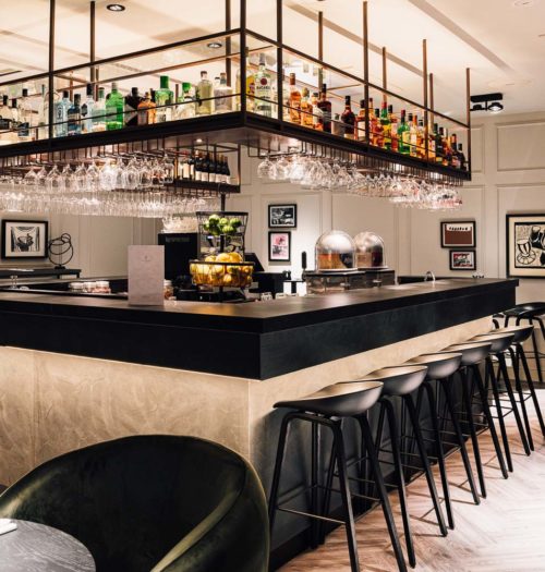 The bar with black stools in Hotel Brussels Centre