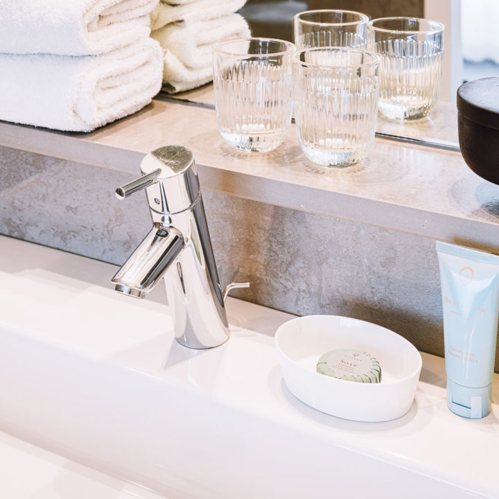 Soap and shampoo on a sink