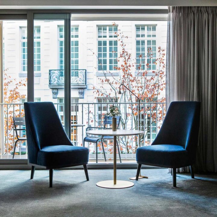Two blue chairs in a hotel room in Ghent