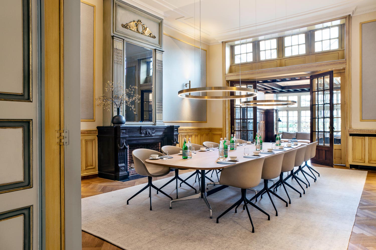 A classic meeting room with a long table in a historic building in Ghent