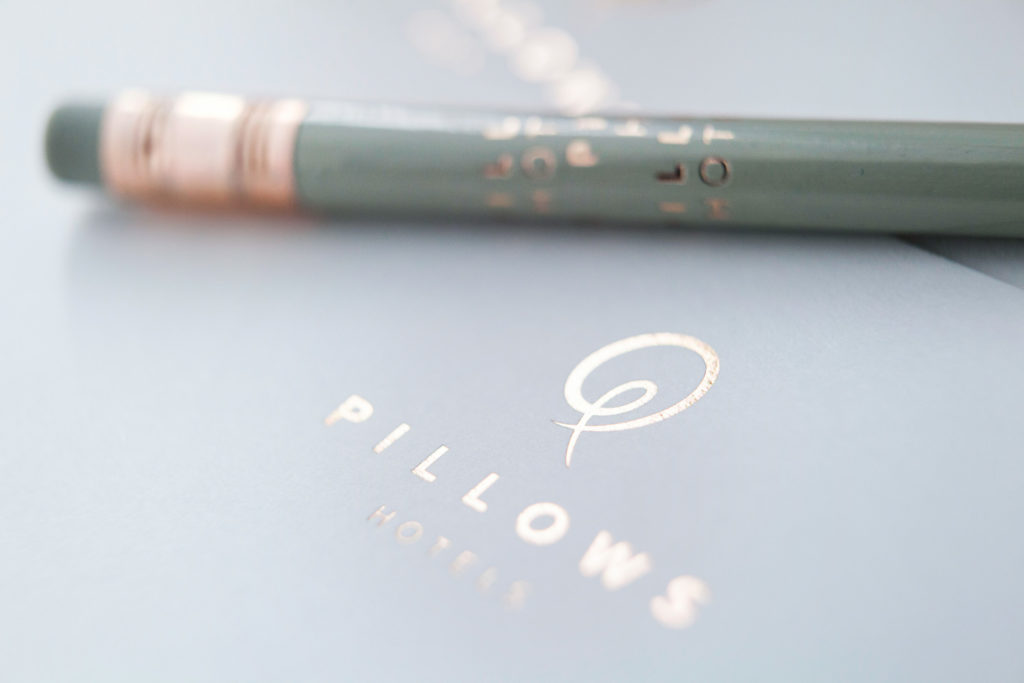Pencil and notebook of Pillows Hotels